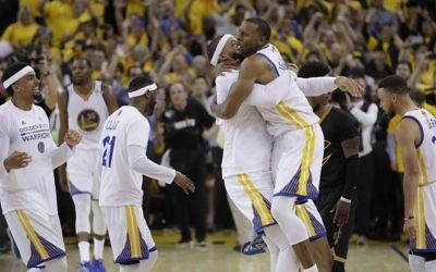 Golden State Warriors players celebrate after beating the Cleveland Cavaliers in Game 5 of basketball's NBA Finals in Oakland, California, June 12, 2017. (AP Photo/Marcio Jose Sanchez)