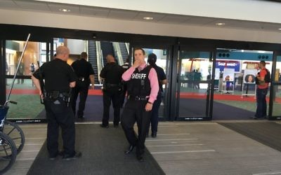 Police officers gather at a terminal at Bishop International Airport, Wednesday morning, June 21, 2017, in Flint, Mich. (Dominic Adams/The Flint Journal-MLive.com via AP)