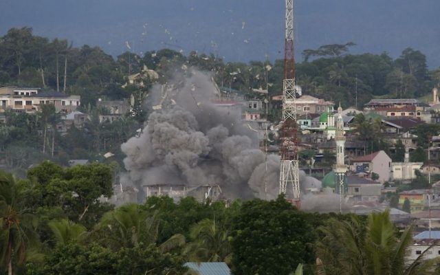 Debris fly as Philippine Air Force fighter jets bomb suspected locations of Muslim militants as fighting continues in Marawi city, southern Philippines, Friday, June 9, 2017. (AP Photo/Aaron Favila) Debris fly as Philippine Air Force fighter jets bomb suspected locations of Muslim militants as fighting continues in Marawi city, southern Philippines, Friday, June 9, 2017. (AP Photo/Aaron Favila)
