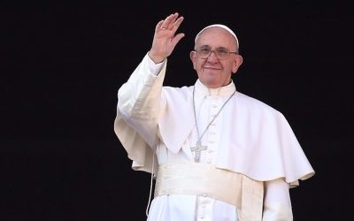Pope Francis waving from the balcony of St. Peter’s Basilica in Vatican City, Dec. 25, 2015. (Franco Origlia/Getty Images via JTA)