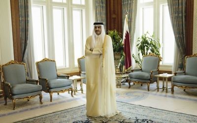 Qatar Emir Sheik Tamim bin Hamad Al-Thani waits for the arrival of U.S. Secretary of State John Kerry ahead of their meeting, at Diwan Palace in Doha, Qatar on August 3, 2015. (Brendan Smialowski/Pool via AP)