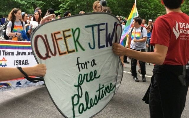 Protesters at the June 4, 2017 New York Celebrate Israel Parade march with the Jewish Queer Youth and hold up a sign saying 'Queer Jews for a Free Palestine.' (Mordechai Levovitz) Protesters at the June 4, 2017 New York Celebrate Israel Parade march with the Jewish Queer Youth and hold up a sign saying 'Queer Jews for a Free Palestine.' (Mordechai Levovitz)