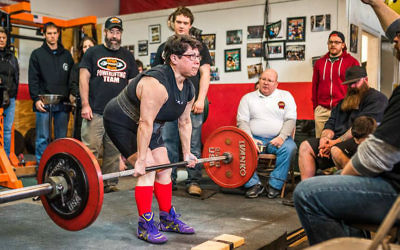 Rabbi Carolyn Braun powerlifting at the March 11 competition at Dyna Maxx gym in Portland, Maine. (Dyna Maxx)