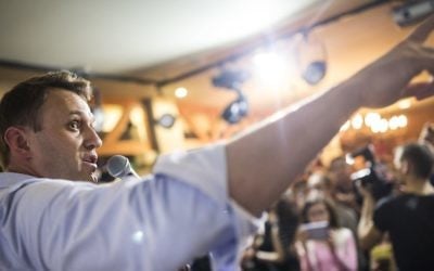 In this photo taken on Friday, June 9, 2017, Russian opposition leader Alexei Navalny gestures while speaking to people in the city of Perm, about 1200 kilometers (750 miles) east of Moscow, Russia. (Evgeny Feldman/Pool Photo via AP)