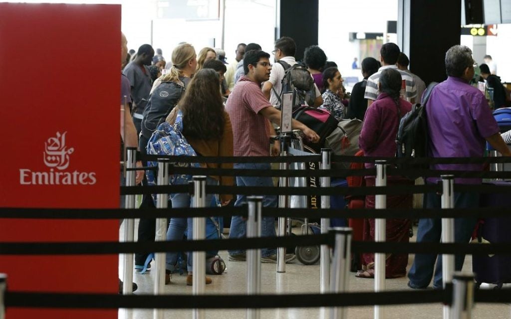 Travelers wait in line near an Emirates ticket counter at the Seattle-Tacoma International Airport, Monday, June 26, 2017, in Seattle, Washington. (AP Photo/Ted S. Warren)