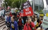 Illustrative: Protesters wave signs and chant during a demonstration against US President Donald Trump's revised travel ban, outside a federal courthouse in Seattle, on May 15, 2017. (AP/Ted S. Warren, File)