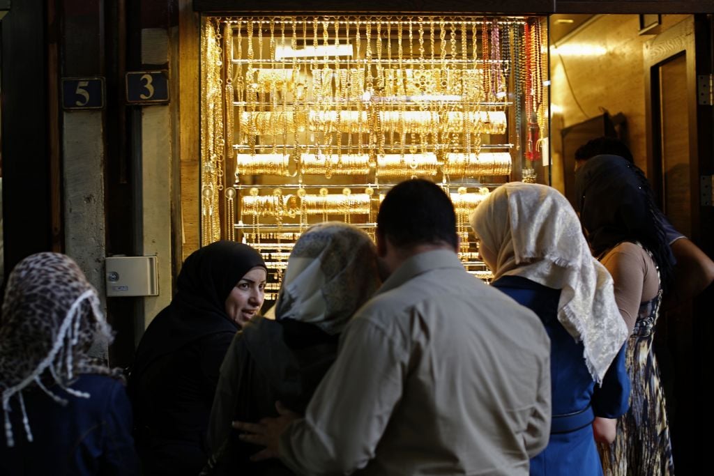 In this May 18, 2017 photo, Syrians shop at the Hamadiyah market, in the Old City of Damascus, Syria. Across the capital, new shops are sprouting up, business is brisk, and some people who fled the war years ago are contemplating a return. The Syrian civil war is likely to drag on for years, but in the seat of President Bashar Assadâs government, there is a general feeling that the six-year conflict is winding down. (AP Photo/Hassan Ammar) In this May 18, 2017 photo, Syrians shop at the Hamadiyah market, in the Old City of Damascus, Syria. (AP Photo/Hassan Ammar)