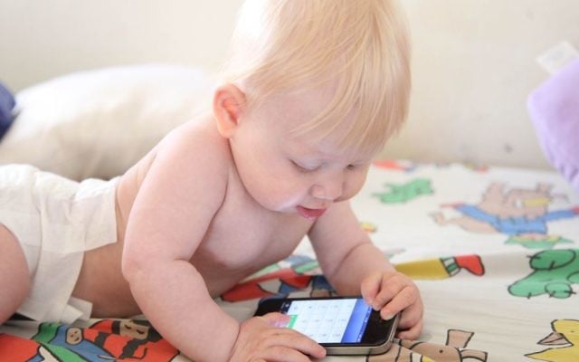 Illustrative photo of a baby playing with an iPhone. (Chen Leopold/flash90) Illustrative photo of a baby playing with an iPhone. (Chen Leopold/flash90)