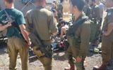 IDF medics treat a Palestinian woman who stabbed a soldier outside the Mevo Dotan settlement in the northern West Bank on June 1, 2017. (Samaria Regional Council)