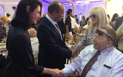 Minister of Education Naftali Bennett (C) with his wife Gilat greet Sheldon Adelson (R) and his wife Miriam at the cornerstone setting ceremony for the new school of medicine at Ariel University, June 28, 2017. (Courtesy)