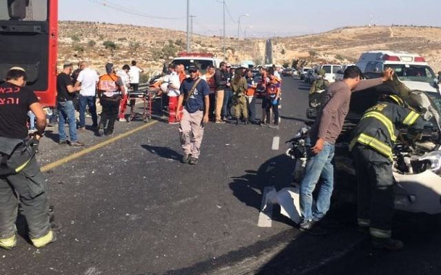 Paramedics on the scene of a deadly car crash on Route 60 in the West Bank on Friday, June 23, 2017. MDA)