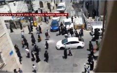 File: Ultra-orthodox men rioting in Jerusalem's Mea Shearim neighborhood against a soldier who arrived for weekend furlough in uniform on Friday, June 9 2017. (Screen capture Channel 2)