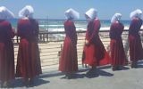 Handmaids at the beach in Tel Aviv, Israel, June 22, 2017. (Courtesy of HOT)