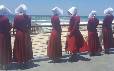Handmaids at the beach in Tel Aviv, Israel, June 22, 2017. (Courtesy of HOT)
