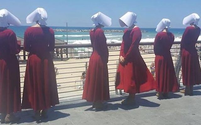 Handmaids at the beach in Tel Aviv, Israel, June 22, 2017. (Courtesy of HOT) Handmaids at the beach in Tel Aviv, Israel, June 22, 2017. (Courtesy of HOT)