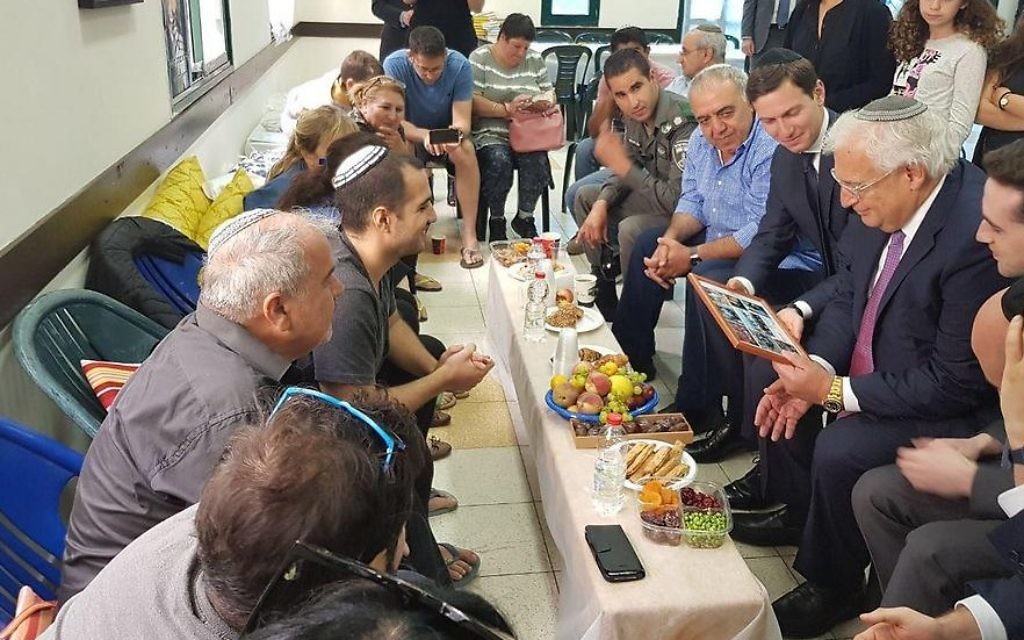 US President Donald Trump’s son-in-law and senior aide Jared Kushner looks on as US Ambassador to Israel David Friedman holds a picture as they pay a condolence call to the bereaved family of slain police officer Hadas Malka on June 21, 2017. (Courtesy)