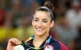 Silver medalist Aly Raisman celebrates on the podium at the medal ceremony for the Women's Floor on Day 11 of the Rio 2016 Olympic Games at the Rio Olympic Arena on August 16, 2016 in Rio de Janeiro, Brazil.  (Photo by Alex Livesey/Getty Images via JTA)
