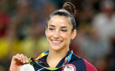 Silver medalist Aly Raisman celebrates on the podium at the medal ceremony for the Women's Floor on Day 11 of the Rio 2016 Olympic Games at the Rio Olympic Arena on August 16, 2016 in Rio de Janeiro, Brazil.  (Photo by Alex Livesey/Getty Images via JTA)