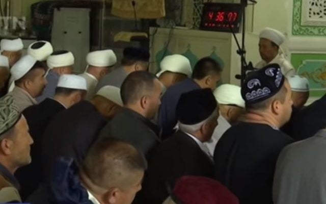 Muslims in China's Xinjiang province gather for prayers during Ramadan, May 2017. (Screen capture: YouTube) Muslims in China's Xinjiang province gather for prayers during Ramadan, May 2017. (Screen capture: YouTube)