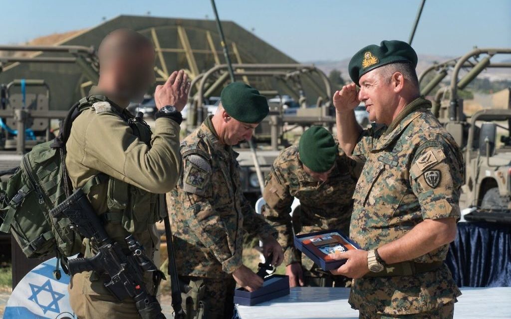A Cypriot officer salutes an IDF officer during an exercise in Cyprus in June 2017. (IDF Spokesperson's Unit)
