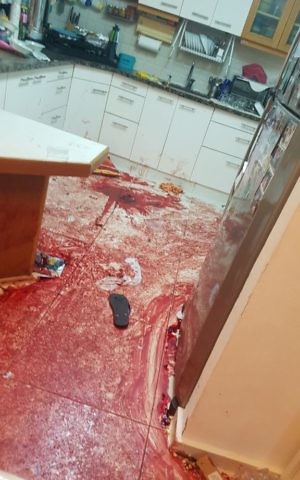 Blood is seen in the kitchen of an Israeli family that was attacked by a terrorist on Friday evening, July 21, 2017. At least three people were stabbed to death and a fourth person wounded in the attack. (IDF Spokesperson's Unit)