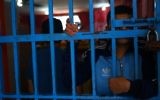 Illustrative: A prisoner behind bars at a Hamas-run prison in Gaza City on May 10, 2017. (AFP Photo/Mohammed Abed)