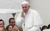 Pope Francis stands on the popemobile as he arrives for a weekly general audience at St Peter's square on June 28, 2017 in Vatican.  (AFP/Vincenzo PINTO)