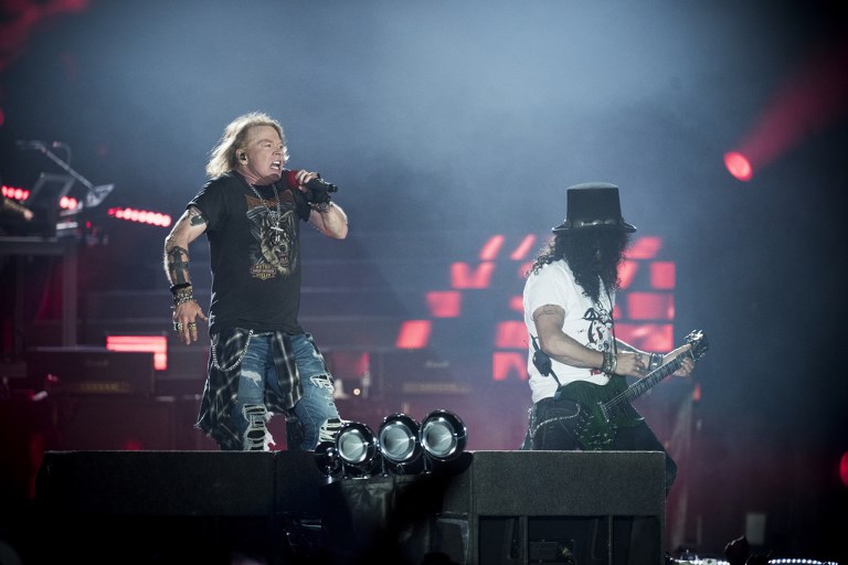 DENMARK-US-MUSIC-GUNS N ROSES Axl Rose (L), lead singer of the US rock band Guns N' Roses, performs with Slash at Parken Stadium, Copenhagen, Denmark, June 27, 2017. / AFP PHOTO / Scanpix Denmark / Mads Joakim Rimer Rasmussen / Denmark OUT