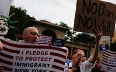 People take part in a rally to protest restrictive guidelines issued by the US on who qualifies as a close familial relationship under the Supreme Court order on the Muslim and refugee ban at Union Square on June 29, 2017, in New York. (AFP Photo/Eduardo Munoz Alvarez)