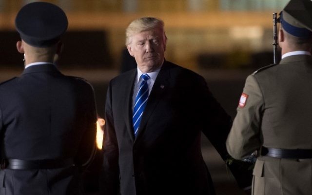 US President Donald Trump is met by a guard of honor after he stepped off Air Force One upon arrival at Chopin Airport in Warsaw, Poland, July 5, 2017. (AFP Photo/Saul Loeb) US President Donald Trump is met by a guard of honor after he stepped off Air Force One upon arrival at Chopin Airport in Warsaw, Poland, July 5, 2017. (AFP Photo/Saul Loeb)