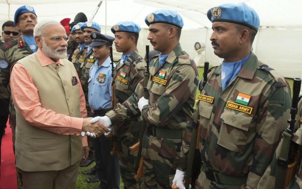 Indian Prime Minister Narendra Modi greets members of the Indian contingent of UNIFIL  during a visit at the the Indian Army Cemetery of the World War I in Haifa, on July 6, 2017.  (AFP/JACK GUEZ)