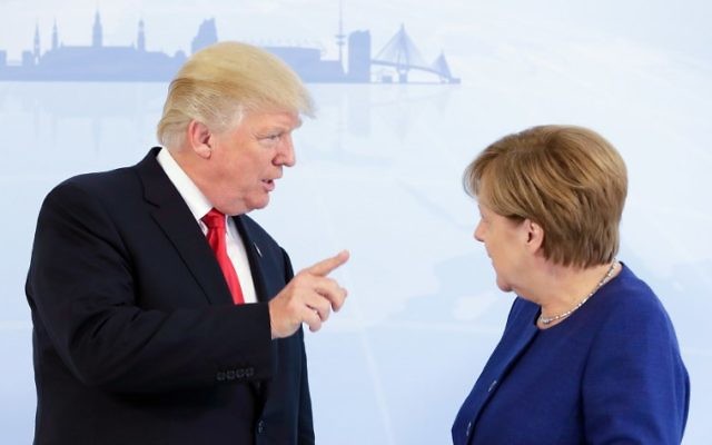 German Chancellor Angela Merkel, and US President Donald Trump pose for a photo prior to a bilateral meeting on the eve of the G20 summit in Hamburg, Germany, on July 6, 2017. (AFP/Pool/Matthias Schrader) German Chancellor Angela Merkel, and US President Donald Trump pose for a photo prior to a bilateral meeting on the eve of the G20 summit in Hamburg, Germany, on July 6, 2017. (AFP/Pool/Matthias Schrader)