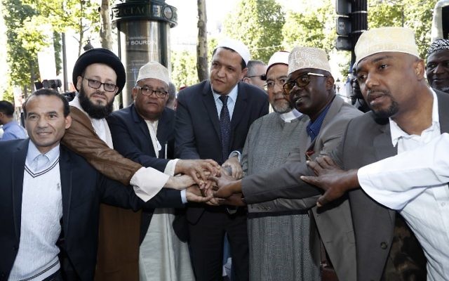 Illustrative image of the Imam of Drancy, Hassen Chalghoumi (C), Lebanese Imam Mohammad Ali Al-Husseini (2L) Egyptian Sheikh Ahmed Mohamed el-Tayeb (3R) posing with others as they prepare to take part in The Muslim March Against Terrorism in Paris on July 8, 2017. (AFP/Francois Guillot) Illustrative image of the Imam of Drancy, Hassen Chalghoumi (C), Lebanese Imam Mohammad Ali Al-Husseini (2L) Egyptian Sheikh Ahmed Mohamed el-Tayeb (3R) posing with others as they prepare to take part in The Muslim March Against Terrorism in Paris on July 8, 2017. (AFP/Francois Guillot)