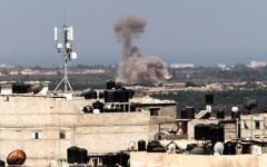 A picture taken from the Rafah border of the southern Gaza Strip with Egypt shows smoke billowing in Egypt's North Sinai on July 8, 2017. (AFP/Said Khatib)