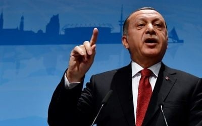 Turkey's President Recep Tayyip Erdogan addresses a press conference at the G20 Summit in Hamburg, Germany, July 8, 2017. (AFP Photo/Tobias Schwarz)