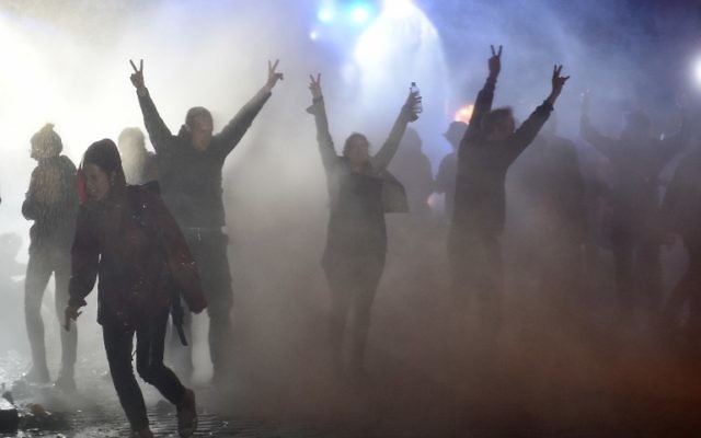 Demonstrators are doused with water cannon by police during riots on July 8, 2017 in Hamburg, northern Germany, after the leaders of the world's top economies gathered for a G20 summit. (AFP / Christof STACHE) Demonstrators are doused with water cannon by police during riots on July 8, 2017 in Hamburg, northern Germany, after the leaders of the world's top economies gathered for a G20 summit. (AFP / Christof STACHE)