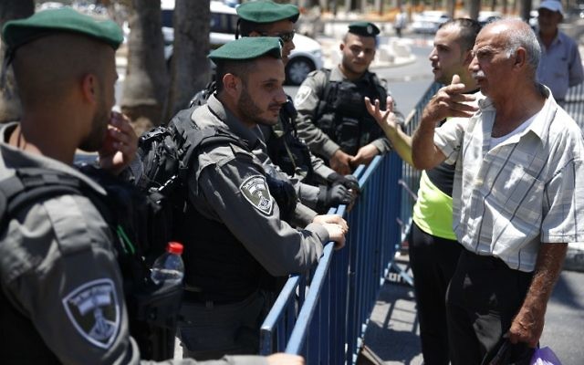 Israeli border policemen stand guard outside Damascus Gate, a main entrance to Jerusalem's Old City, on July 15, 2017, after security forces locked down parts of Jerusalem's Old City and an ultra-sensitive holy site remained closed following an attack that killed two police officers and heightened Israeli-Palestinian tensions. (AFP PHOTO / AHMAD GHARABLI)