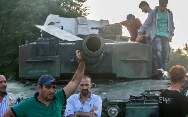 This file photo taken on July 16, 2016 shows People reacting after taking over a military position on the Bosphorus bridge in Istanbul. ( AFP PHOTO / GURCAN OZTURK) This file photo taken on July 16, 2016 shows People reacting after taking over a military position on the Bosphorus bridge in Istanbul. ( AFP PHOTO / GURCAN OZTURK)