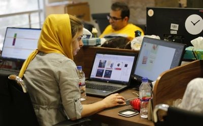 Bamilo employees work at the e-commerce site's offices in the Iranian capital Tehran on July 9, 2017. (AFP/ATTA KENARE)