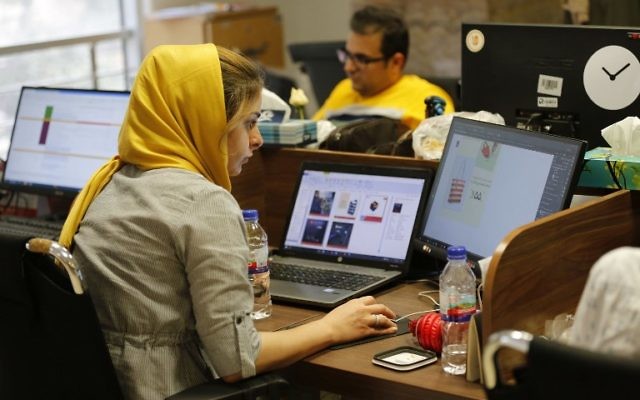 Bamilo employees work at the e-commerce site's offices in the Iranian capital Tehran on July 9, 2017. (AFP/ATTA KENARE) Bamilo employees work at the e-commerce site's offices in the Iranian capital Tehran on July 9, 2017. (AFP/ATTA KENARE)