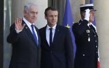 File: Prime Minister Benjamin Netanyahu, left, waves as he stands next to French President Emmanuel Macron, right, upon his arrival at the Elysee Palace, in Paris, on July 15, 2017 ahead of their meeting. (AFP Photo/Geoffroy Van Der Hasselt)