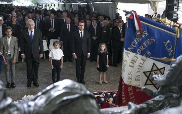 Prime Minister Benjamin Netanyahu (2nd L) and French President Emmanuel Macron (2nd R) pay their respects after laying wreaths during a ceremony commemorating the 75th anniversary of the Vel d'Hiv roundup in Paris on July 16, 2017. (AFP Photo/Pool/Kamil Zihnioglu) Prime Minister Benjamin Netanyahu (2nd L) and French President Emmanuel Macron (2nd R) pay their respects after laying wreaths during a ceremony commemorating the 75th anniversary of the Vel d'Hiv roundup in Paris on July 16, 2017. (AFP Photo/Pool/Kamil Zihnioglu)