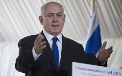 Prime Minister Benjamin Netanyahu delivers a speech during a ceremony commemorating the 75th anniversary of the Vel d'Hiv roundup in Paris on July 16, 2017. (AFP Photo/Pool/Kamil Zihnioglu)