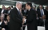 French President Emmanuel Macron (R) shakes hands with Prime Minister Benjamin Netanyahu during a ceremony commemorating the 75th anniversary of the Vel d'Hiv roundup in Paris on July 16, 2017. (AFP Photo/Pool/Kamil Zihnioglu)