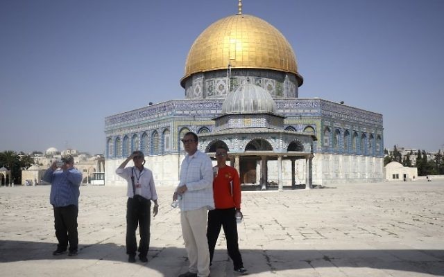 Tourists walk around the Dome of the Rock in the Temple Mount compound in Jerusalem, on July 17, 2017. AFP/THOMAS COEX) Tourists walk around the Dome of the Rock in the Temple Mount compound in Jerusalem, on July 17, 2017. AFP/THOMAS COEX)