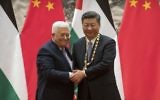 Palestinian Authority President Mahmoud Abbas (L) shakes hands with Chinese President Xi Jinping during a signing ceremony at the Great Hall of the People in Beijing on July 18, 2017. (AFP Photo/Pool/Mark Schiefelbein)