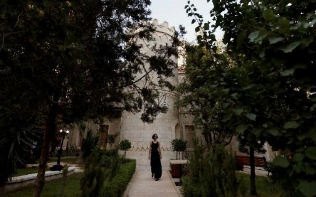 A woman attends the re-opening of the Sergei Compound in Jerusalem after six years of renovation work, July 18, 2017. (AFP PHOTO / GALI TIBBON) A woman attends the re-opening of the Sergei Compound in Jerusalem after six years of renovation work, July 18, 2017. (AFP PHOTO / GALI TIBBON)
