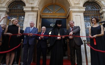 Members of a Russian delegation including former Russian prime minister Sergey Vadimovich Stepahin (2R) cut a ribbon during the re-opening of the Sergei Compound in Jerusalemafter six years of renovation work, July 18, 2017, (AFP PHOTO/GALI TIBBON)