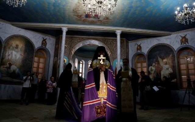 Russian-Orthodox religious figures attend the re-opening of the Sergei Compound in Jerusalem after six years of renovation work, July 18, 2017, (AFP PHOTO / GALI TIBBON) Russian-Orthodox religious figures attend the re-opening of the Sergei Compound in Jerusalem after six years of renovation work, July 18, 2017, (AFP PHOTO / GALI TIBBON)