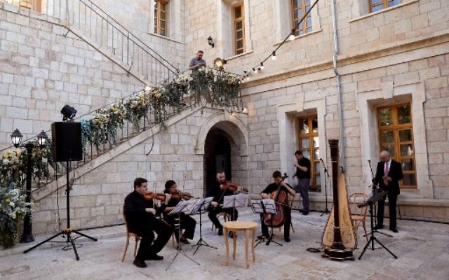 Musicians play during the re-opening of the Sergei Compound in Jerusalem after six years of renovation work, July 18, 2017, (AFP PHOTO / GALI TIBBON) Musicians play during the re-opening of the Sergei Compound in Jerusalem after six years of renovation work, July 18, 2017, (AFP PHOTO / GALI TIBBON)